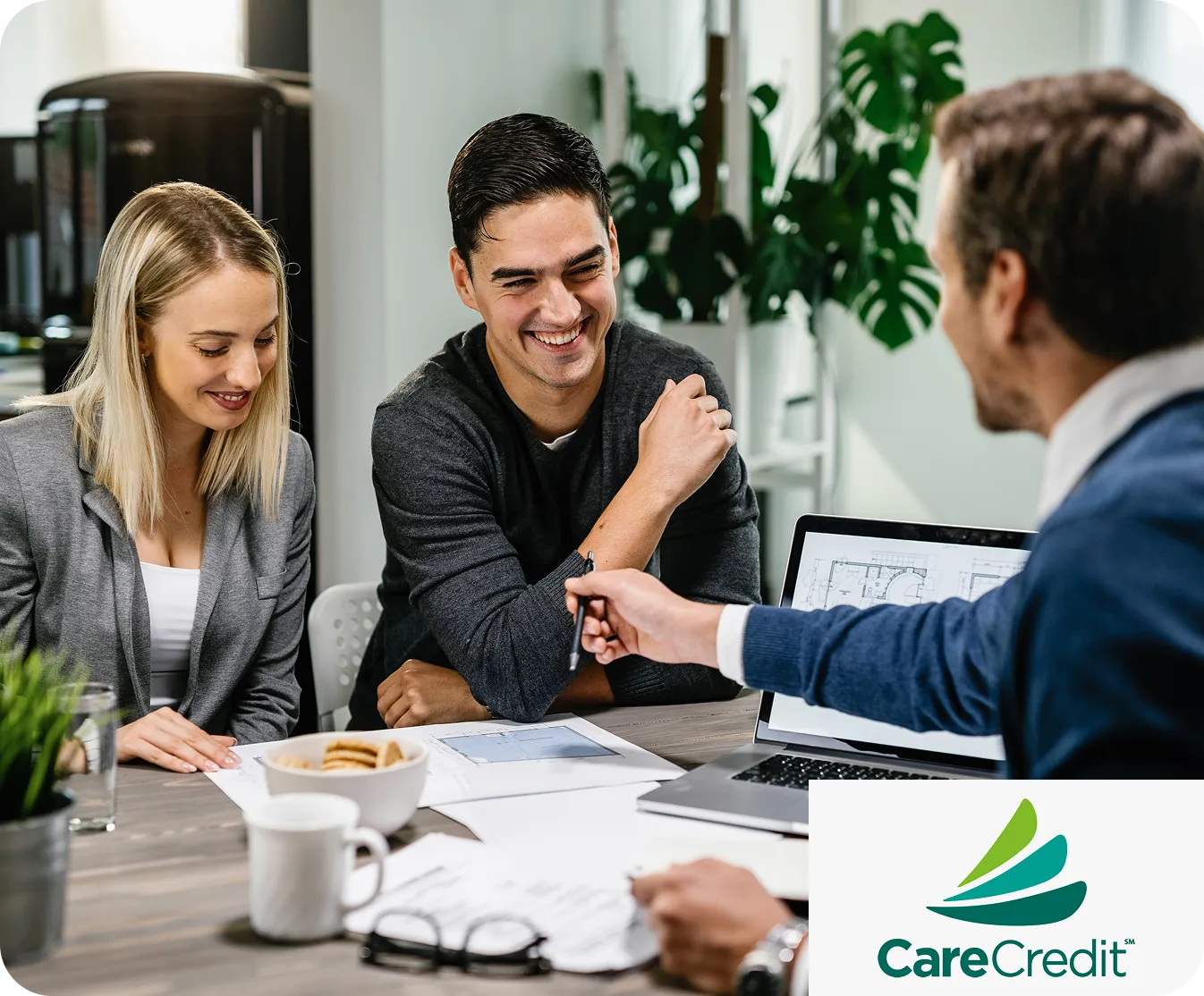 Couple meeting with an advisor about CareCredit financing