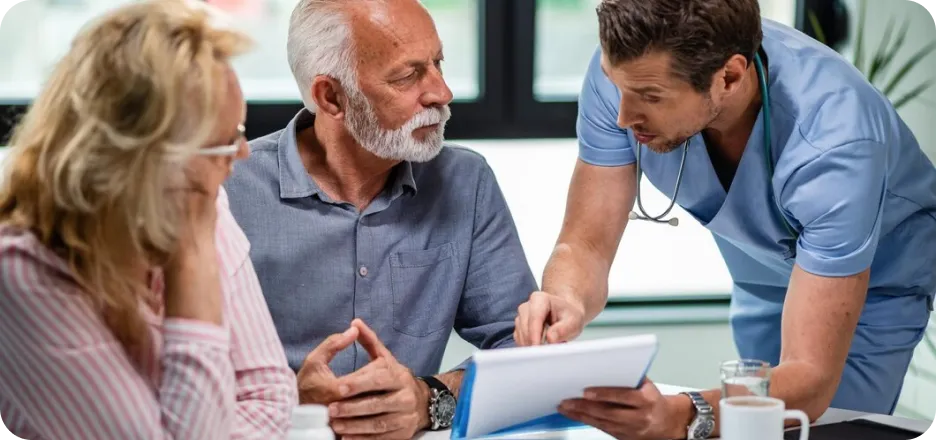 Provider reviewing progress with patients on a tablet